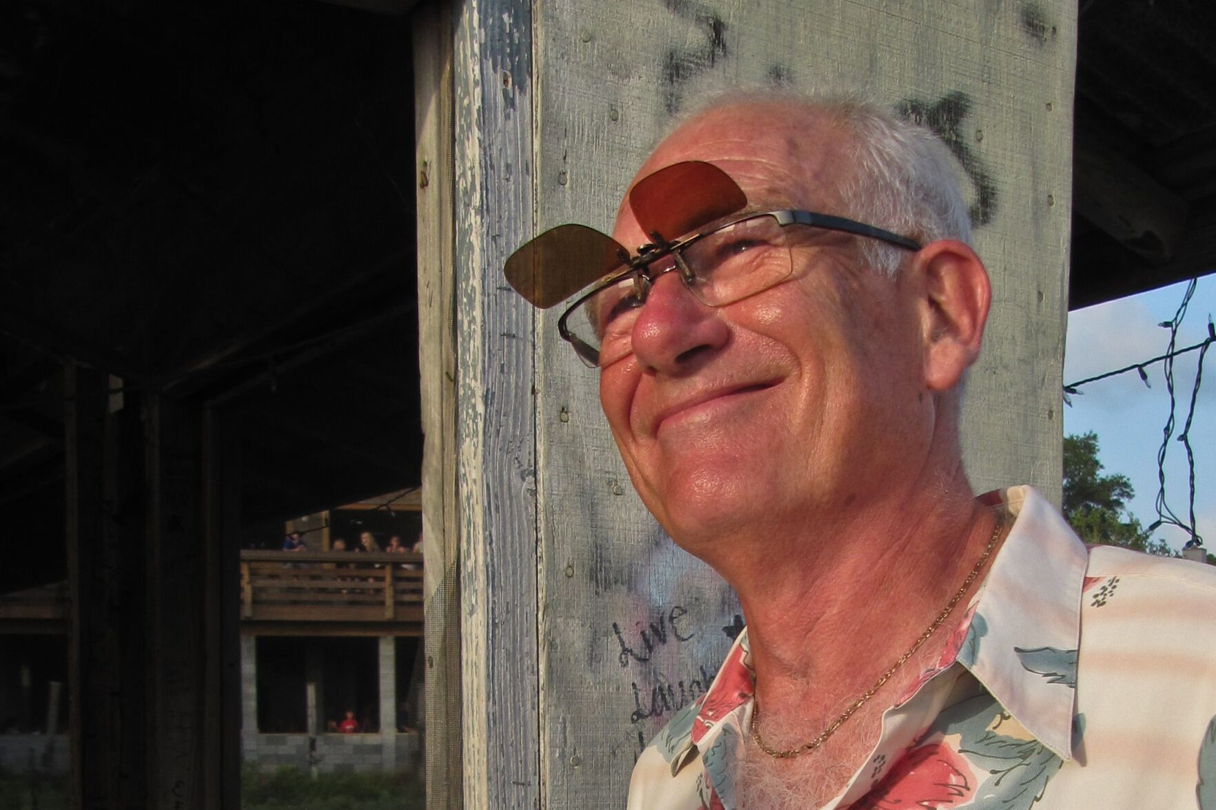 Man sporting clip-on sunglasses.